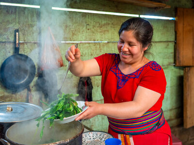 Maria prepares a meal at her home in the Pexlá Grande community of Nebaj municipality, Quiché, Guatemala, on 3 August 2023.