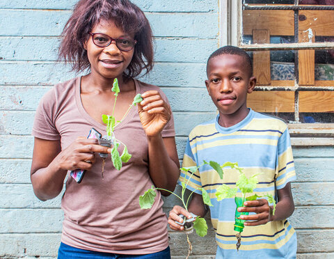 Mother and son with plants
