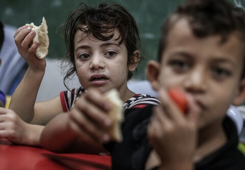 Child in Palestine with bread