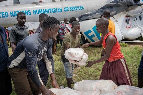 Food is unloaded from an UNHAS plane