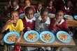 Schoolchildren enjoy a lunch made with salvaged pulses in Kenya. Photo: WFP/<a href=%27https_/insight.wfp.org/ugly-vegetables-destined-for-the-dump-are-now-helping-to-feed-thousands-of-schoolchildren-in-kenya-68c8c920aa70%27.html data-medium-id='68c8c920aa70'>Martin Karimi</a>