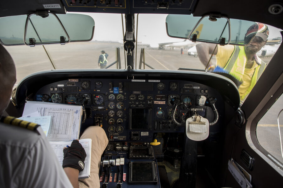 UNHAS pilots make final checks in Bangui, before heading to Bambari one recent morning. WFP/Aurore Vinot