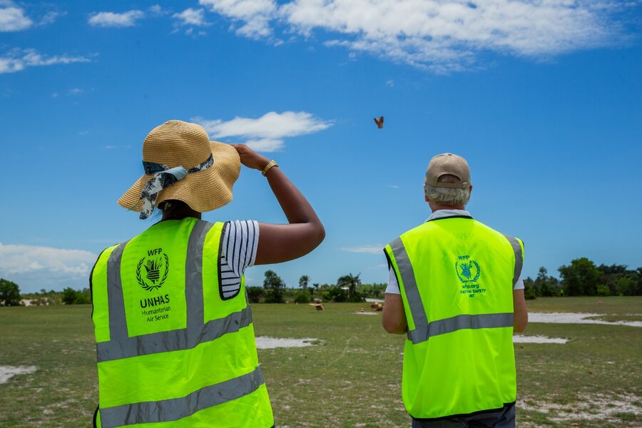 WFP staff in Madagascar watch an unmanned aircraft system arrive. The groundbreaking technology is vital for delivering aid to remote communities. WFP