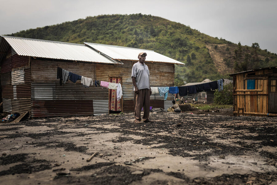Hamuli Machumu surveys the barren land around his home in the eastern Congolese town of Sake, where he has returned after months at a camp for displaced people. WFP/Jerry Ally Kahashi