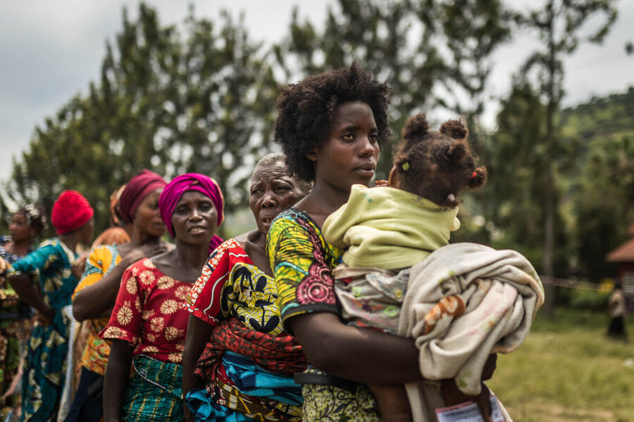 Women line up for WFP food in the town of Sake, in eastern DRC. More than 10 million people in the region face acute hunger. WFP/Jerry Ally Kahashi