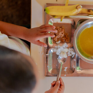 A Venezuelan kid is eating his fresh and locally purchased food