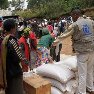 WFP food distribution site at Nkamira refugee transit center, western Rwanda. WFP is ready to provide emergency food assistance to the most vulnerable people if needed and also strengthens national preparedness efforts for disaster response to minimize the impact on communities. Photo: WFP/JohnPaul SESONGA