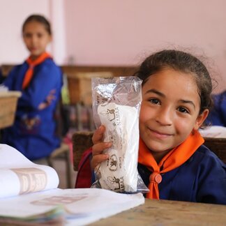 Salma from Aleppo likes Homos sandwiches that WFP provides to nearly 30,000 students in 30 schools in Aleppo city every school day. Photo: © WFP/Hussam Al Saleh.