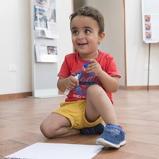 A child playing with a pen