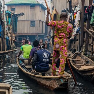 People in a canoe. Photo: WFP/Damilola Onafuwa