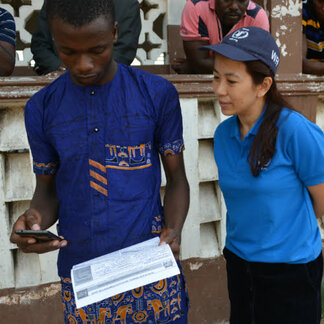 WFP staff and a beneficiary in Benin interacting